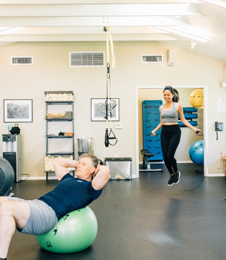 Couple using gym