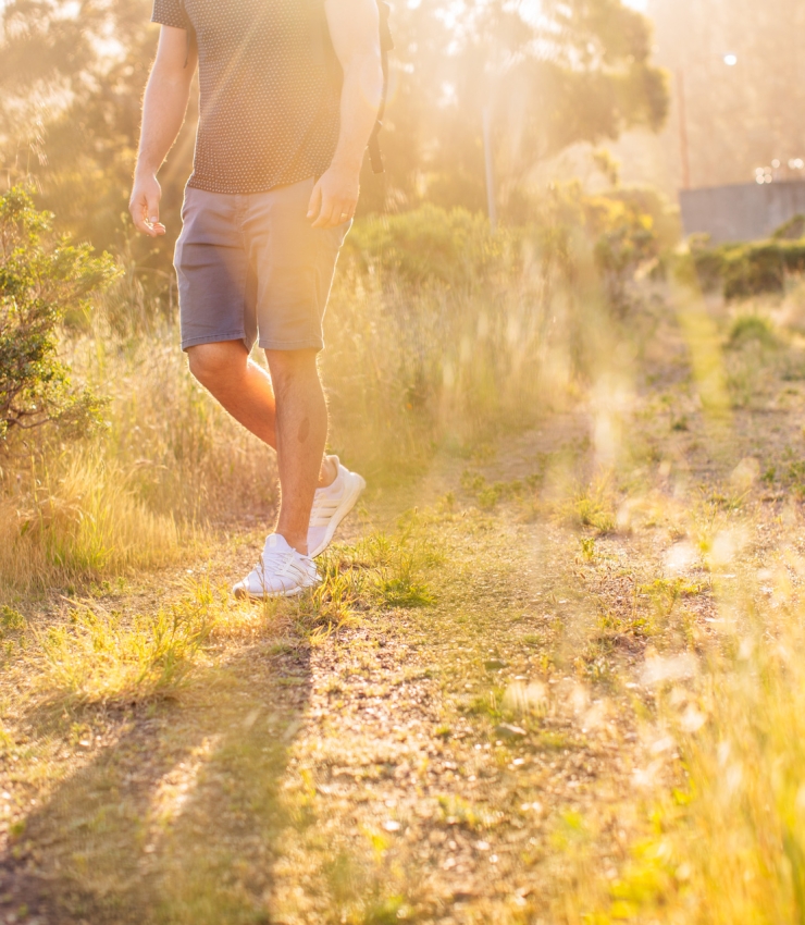 man legs hiking sunny