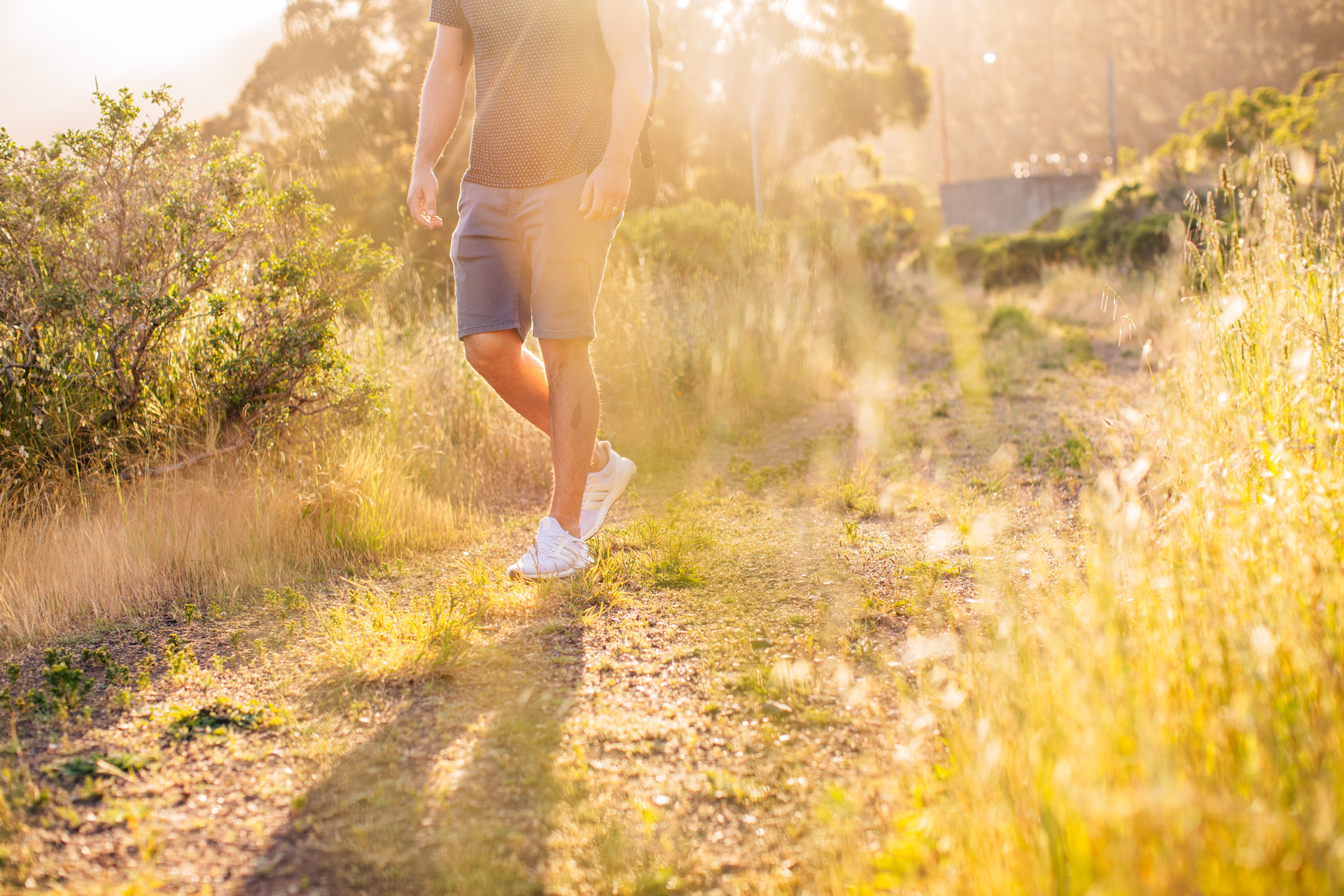 man legs hiking sunny