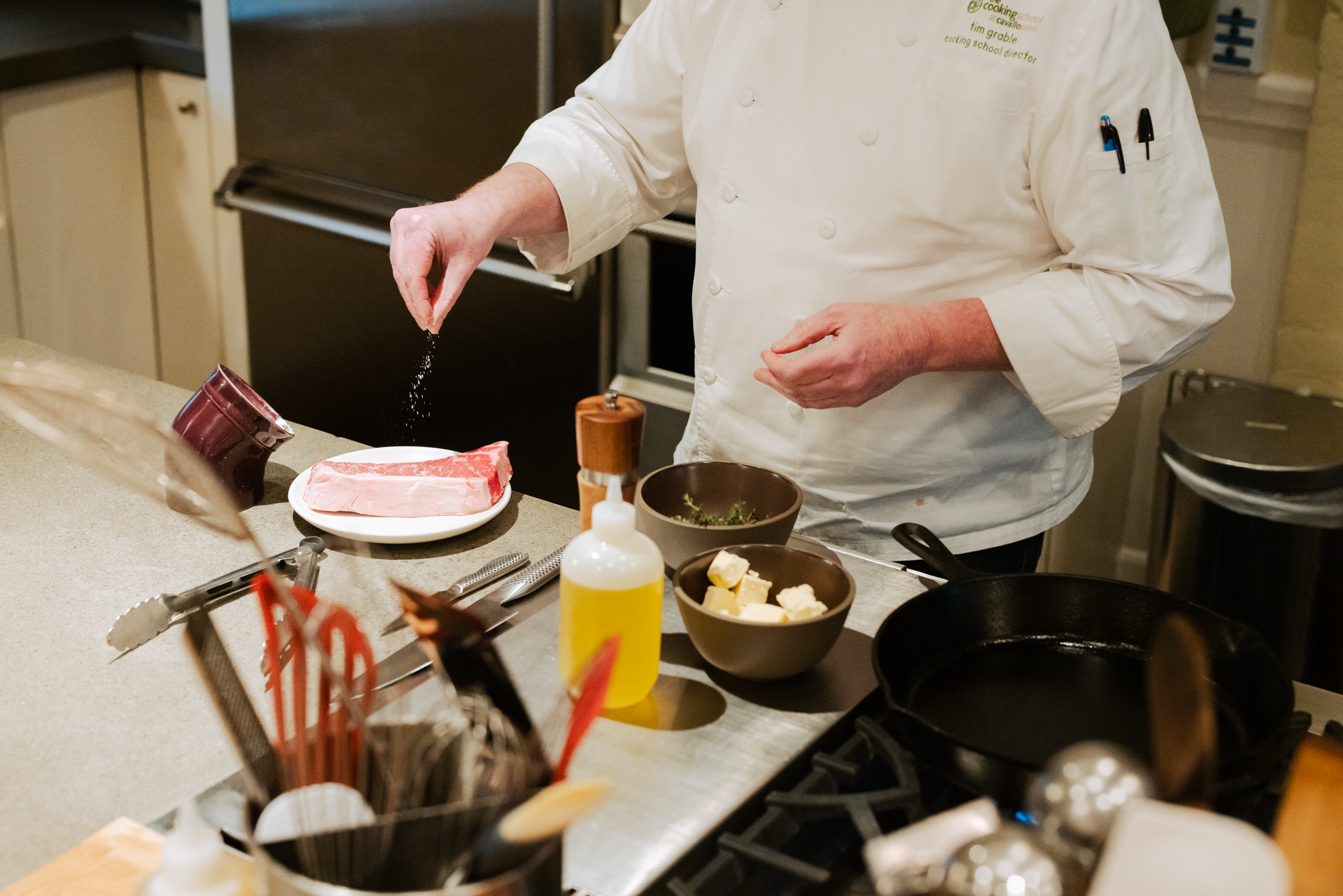 Chef salting steak